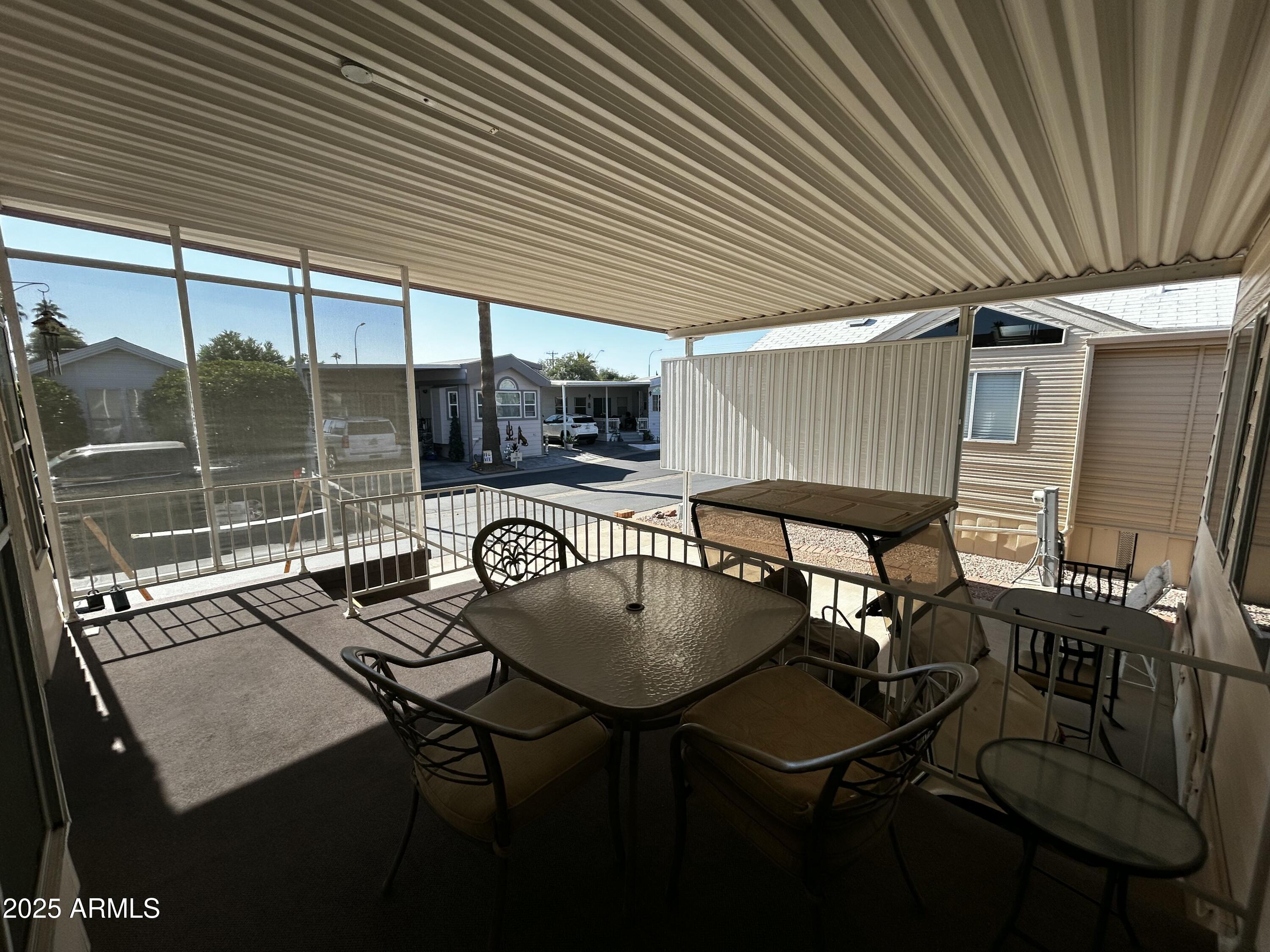 111 South Greenfield Road, Unit 596 Mesa, AZ 85206 - Photo 6 of 26 a outdoor dining space with furniture and outdoor view