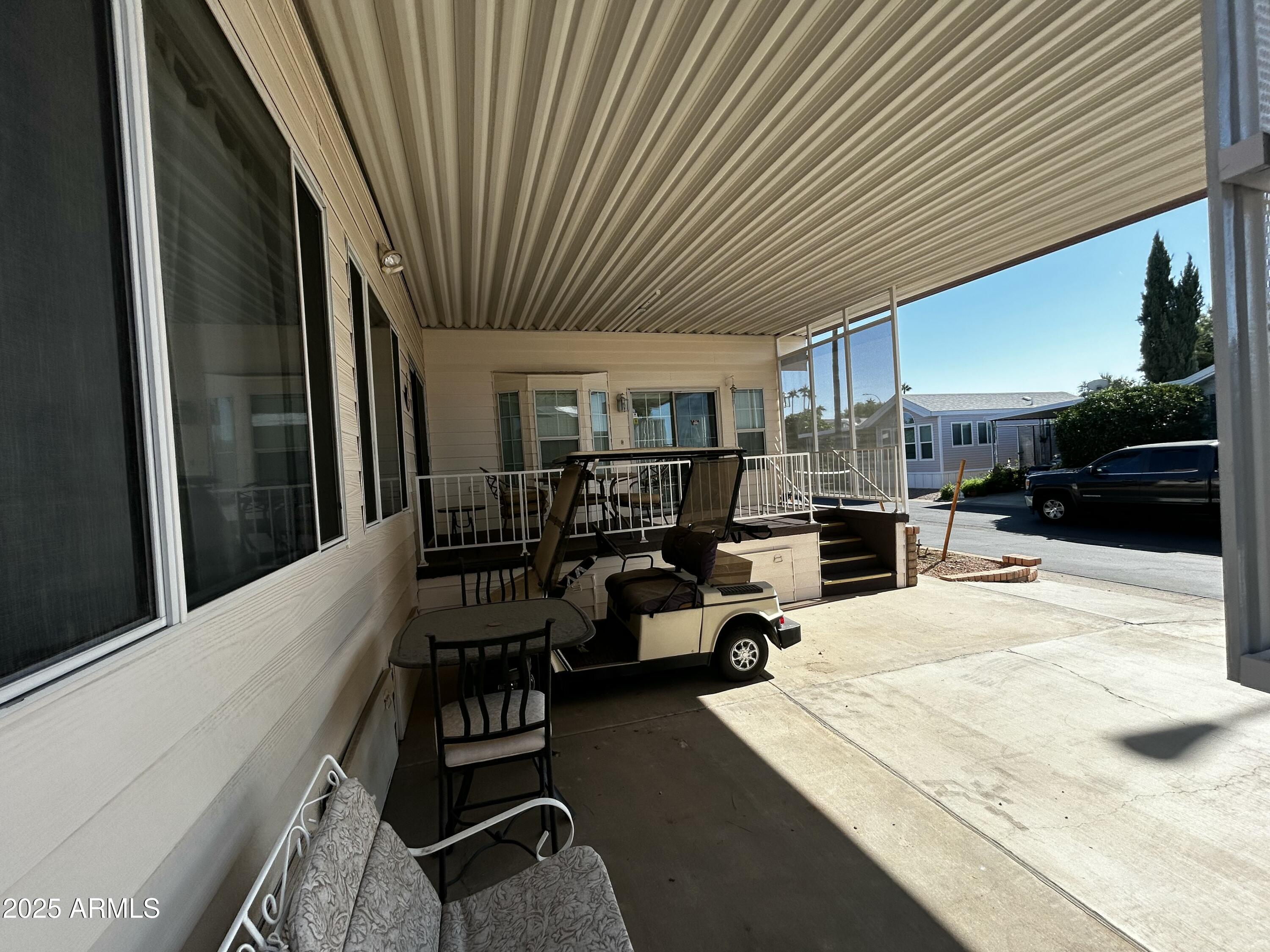 111 South Greenfield Road, Unit 596 Mesa, AZ 85206 - Photo 7 of 26 a outdoor space with patio furniture and a couch