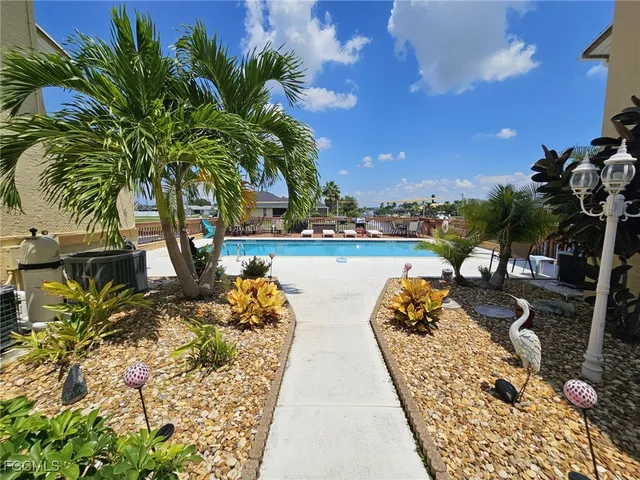 a view of a lake with a house in the background