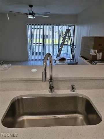a kitchen with a sink and a window