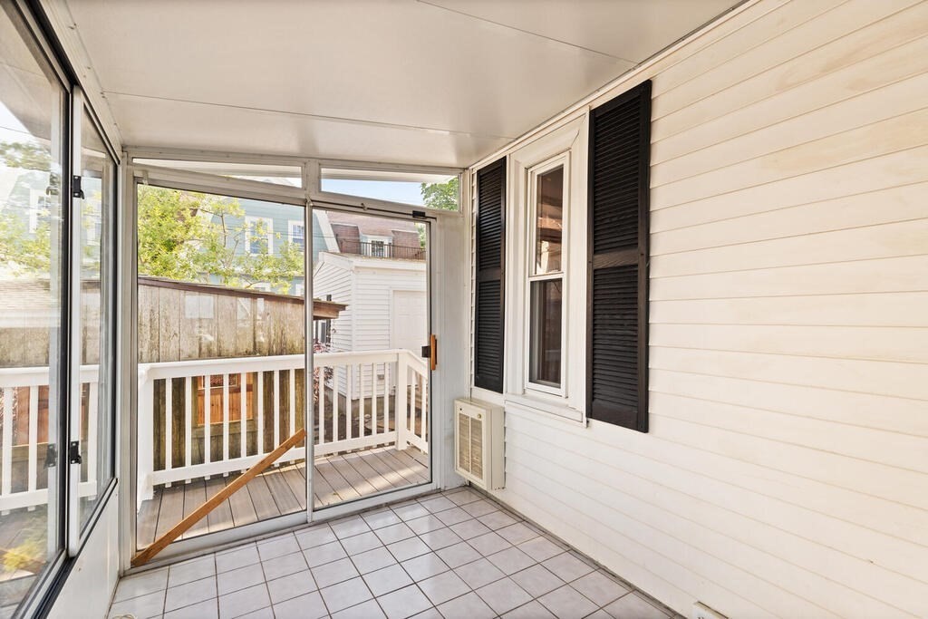 1 Shore Avenue Salem, MA 01970 - Photo 14 of 42 a view of a porch with wooden floor
