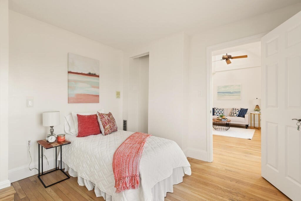 1 Shore Avenue Salem, MA 01970 - Photo 21 of 42 a bedroom with a bed and wooden floor