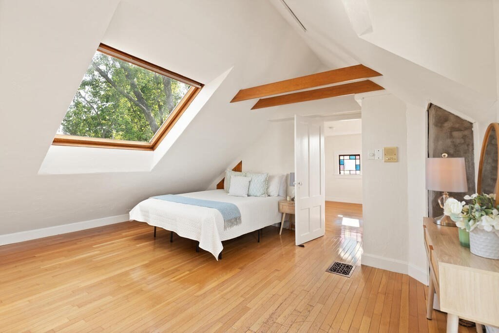 1 Shore Avenue Salem, MA 01970 - Photo 23 of 42 a bedroom with a bed and wooden floor