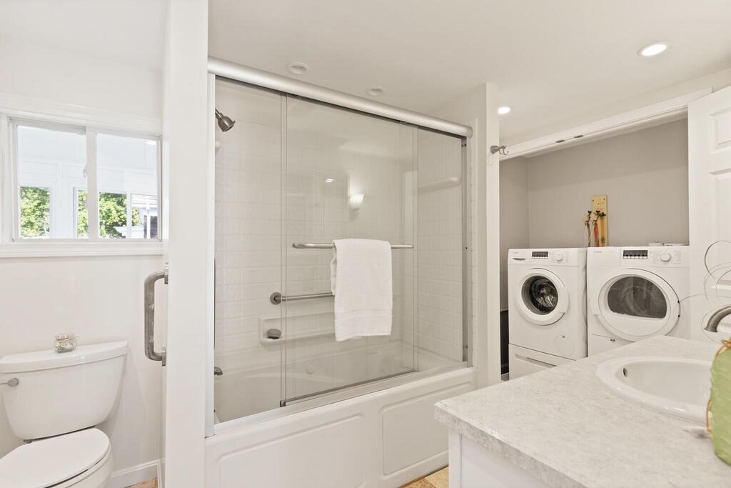 1 Shore Avenue Salem, MA 01970 - Photo 26 of 42 a bathroom with a bathtub shower sink mirror vanity and toilet