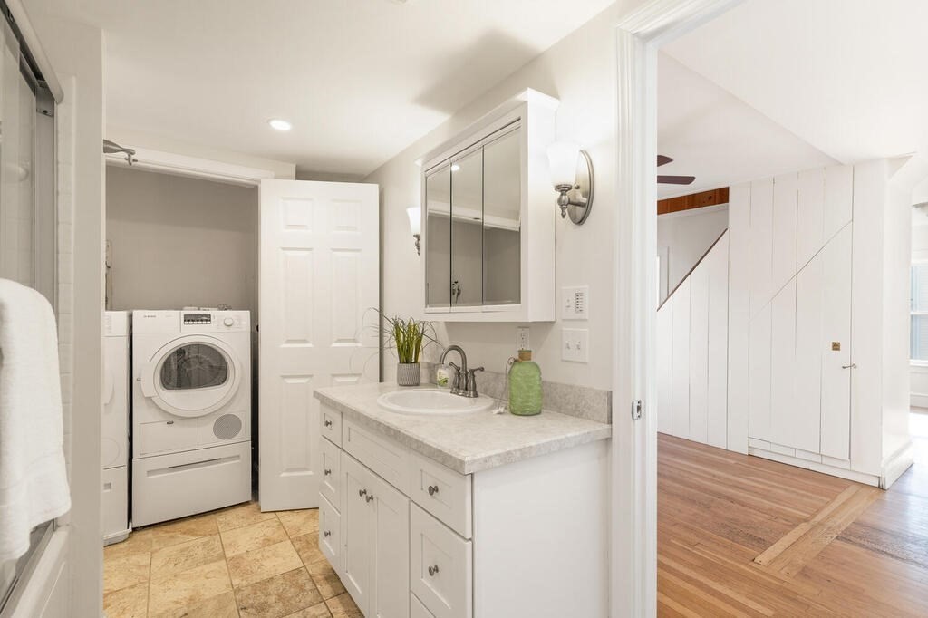 1 Shore Avenue Salem, MA 01970 - Photo 27 of 42 a bathroom with a sink a washer and dryer