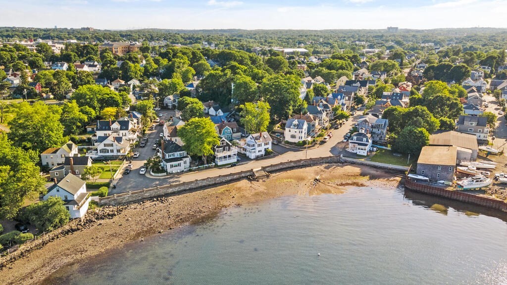 1 Shore Avenue Salem, MA 01970 - Photo 37 of 42 an aerial view of a house with a swimming pool and lake view