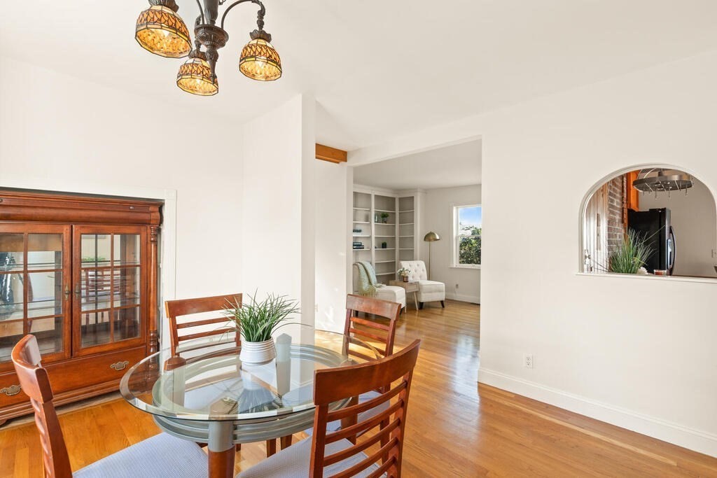 1 Shore Avenue Salem, MA 01970 - Photo 6 of 42 a view of a dining room with furniture a chandelier and wooden floor