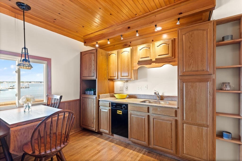 1 Shore Avenue Salem, MA 01970 - Photo 7 of 42 a kitchen with a sink appliances and cabinets