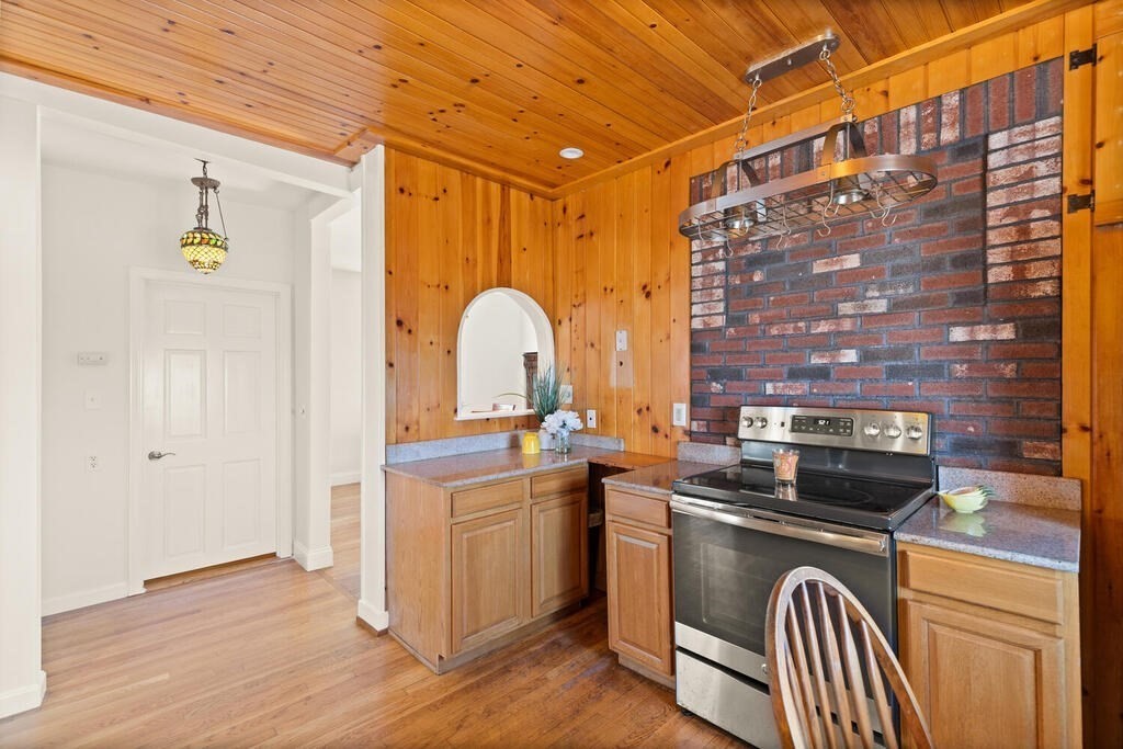 1 Shore Avenue Salem, MA 01970 - Photo 10 of 42 a kitchen with a sink and a stove top oven