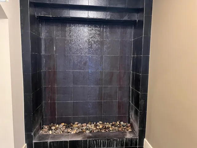 a bathroom with a glass shower door