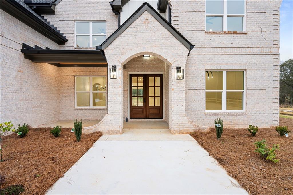 3287 Hall Road Dacula, GA 30019 - Photo 4 of 74 a front view of a house with a yard
