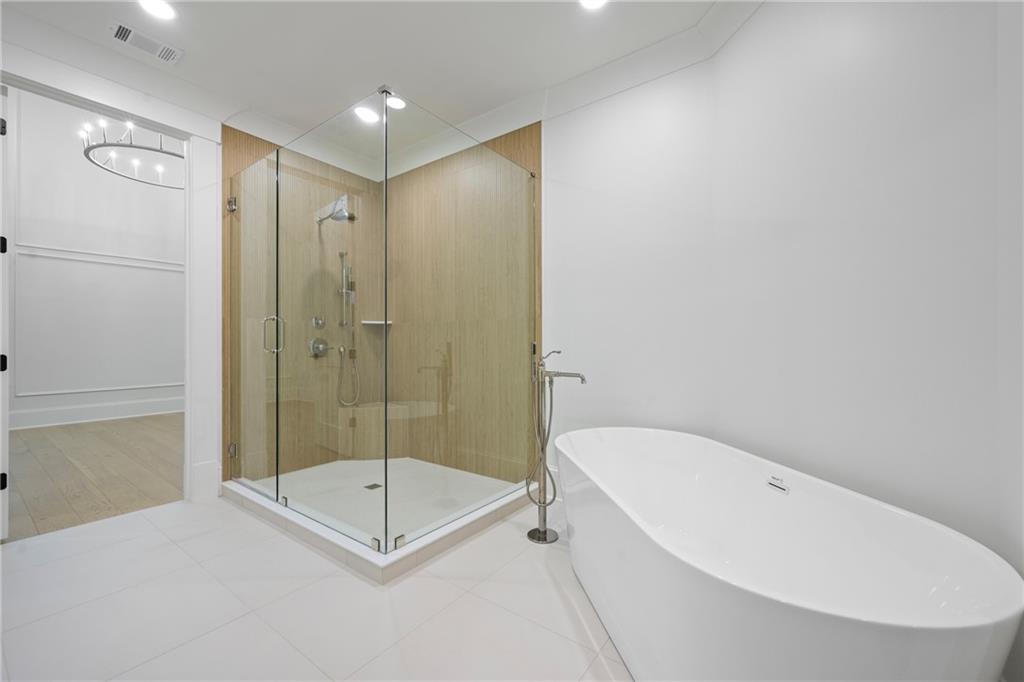 3287 Hall Road Dacula, GA 30019 - Photo 43 of 74 a bathroom with a tub and shower