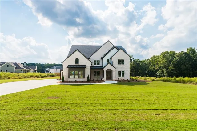 a view of a house with swimming pool and an outdoor space