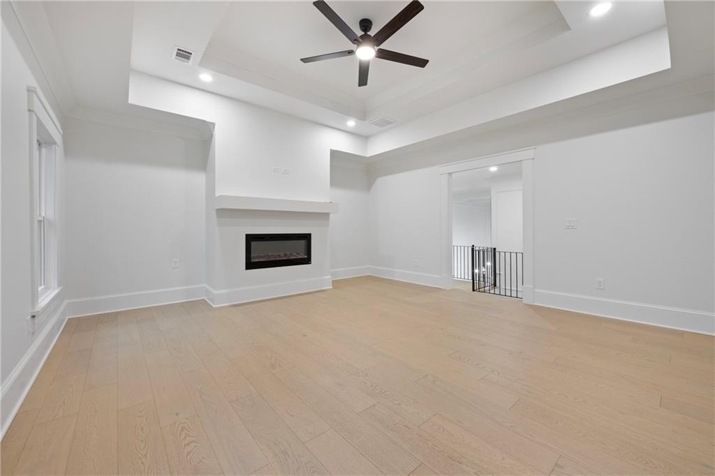 3287 Hall Road Dacula, GA 30019 - Photo 51 of 74 an empty room with fireplace and windows