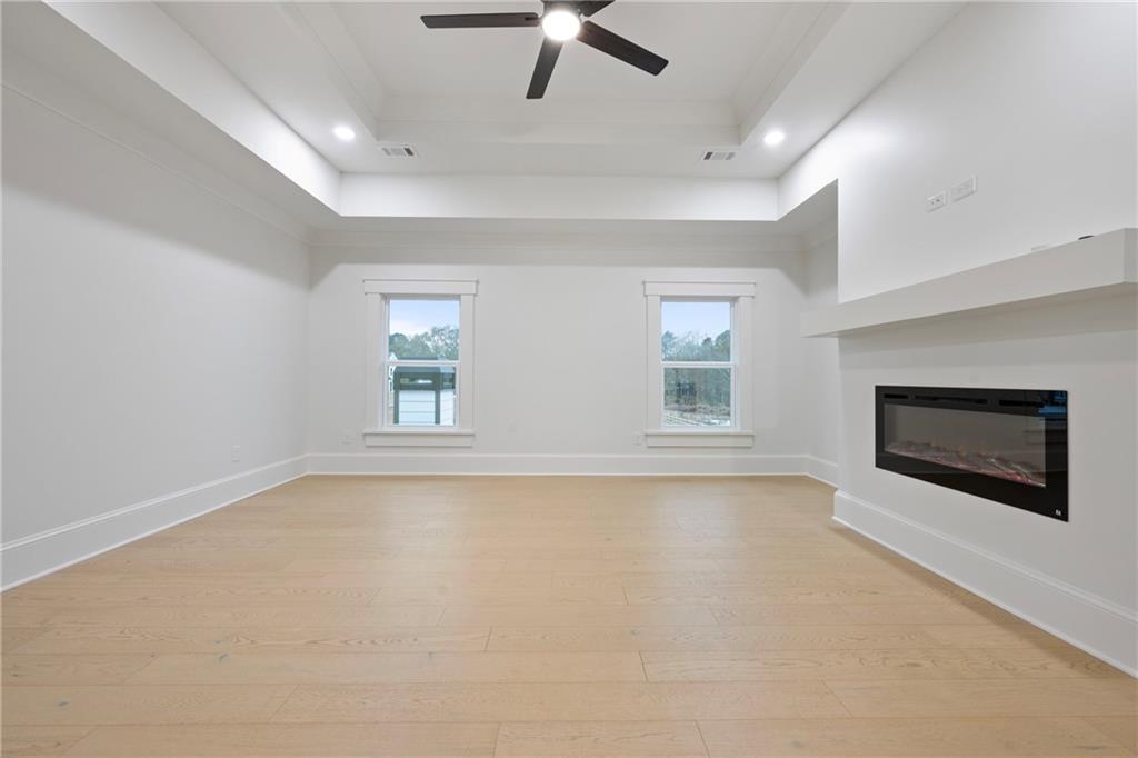 3287 Hall Road Dacula, GA 30019 - Photo 52 of 74 an empty room with windows and fireplace