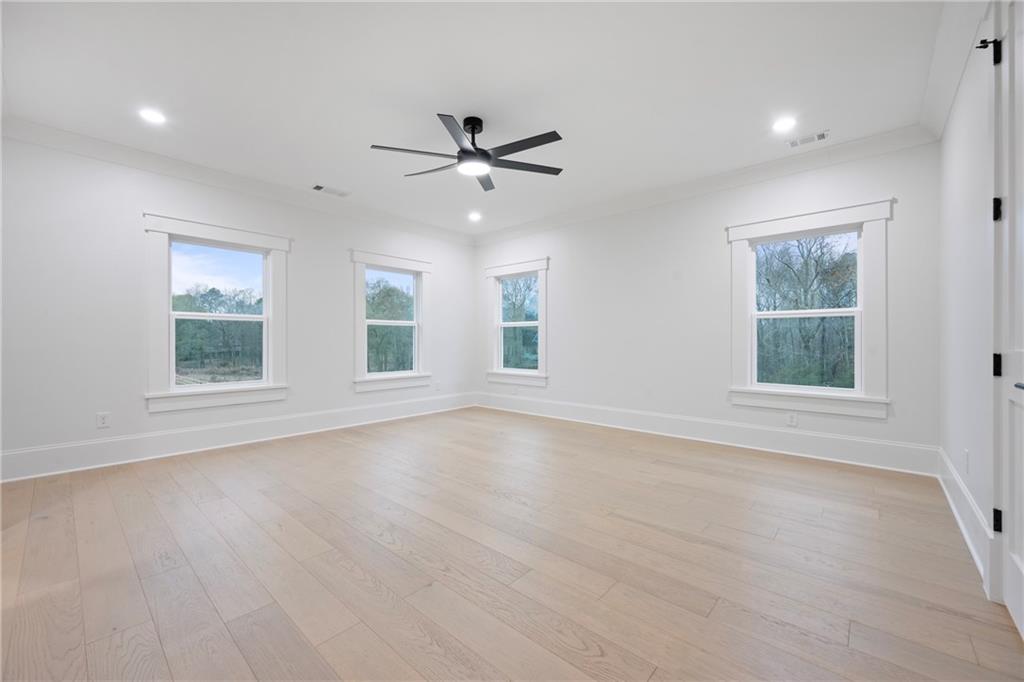 3287 Hall Road Dacula, GA 30019 - Photo 54 of 74 a view of an empty room with a window and wooden floor