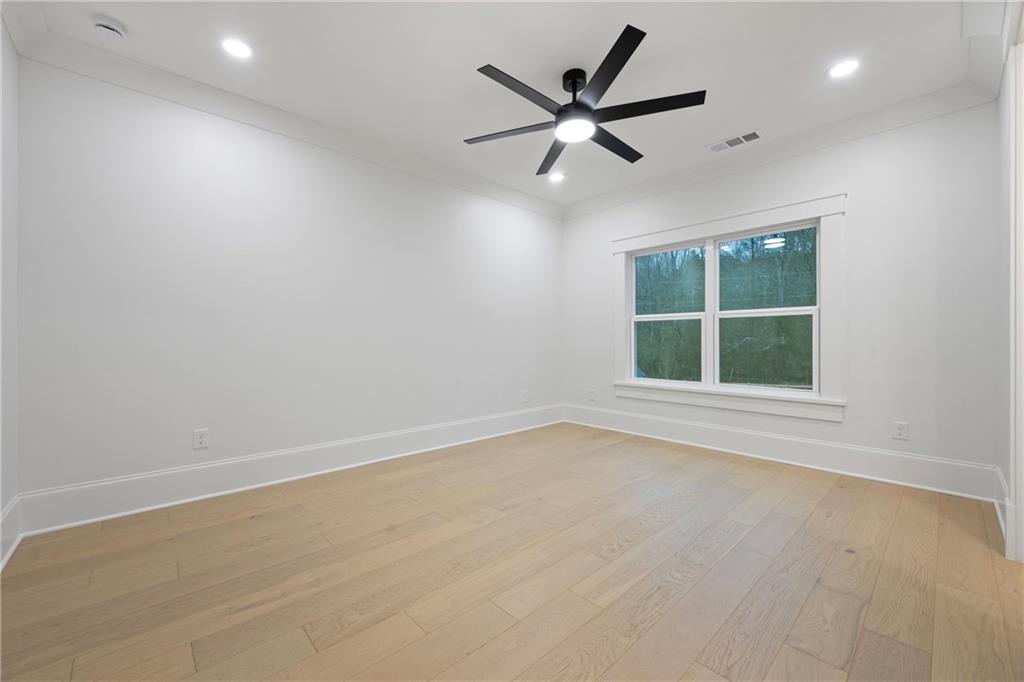 3287 Hall Road Dacula, GA 30019 - Photo 58 of 74 an empty room with a window and a fan