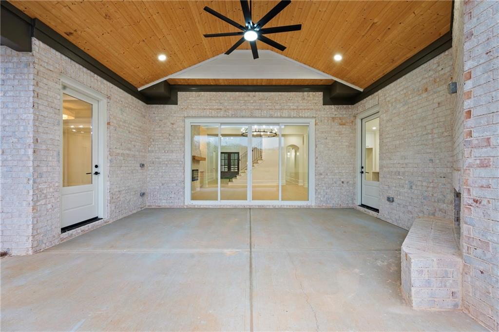 3287 Hall Road Dacula, GA 30019 - Photo 62 of 74 an empty room with chandelier fan and windows