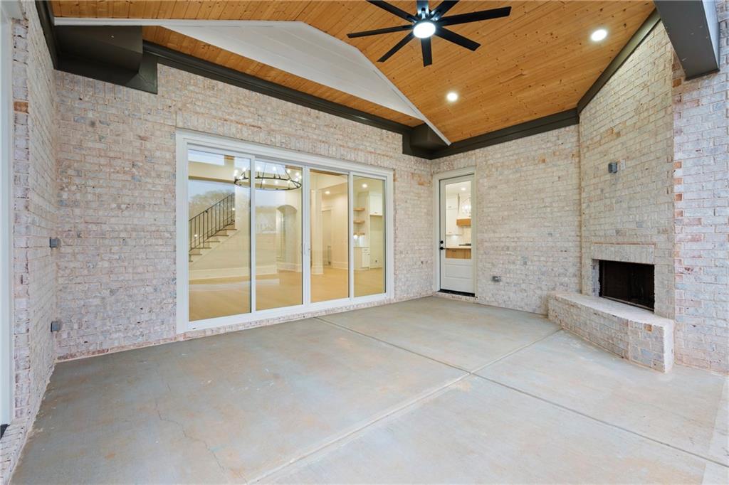 3287 Hall Road Dacula, GA 30019 - Photo 63 of 74 a view of an empty room with a fireplace and a window