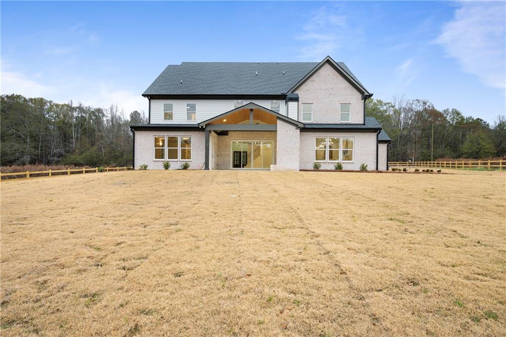 3287 Hall Road Dacula, GA 30019 - Photo 65 of 74 a front view of a house with a yard