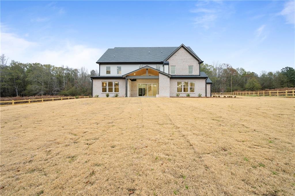 3287 Hall Road Dacula, GA 30019 - Photo 67 of 74 a view of house with yard and trees in the background