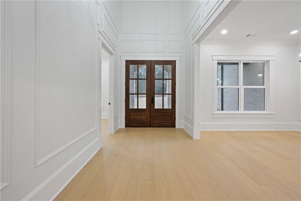 3287 Hall Road Dacula, GA 30019 - Photo 9 of 74 wooden floor in an empty room with a window