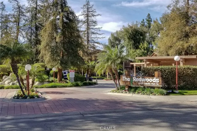 a view of yard with swimming pool and green space