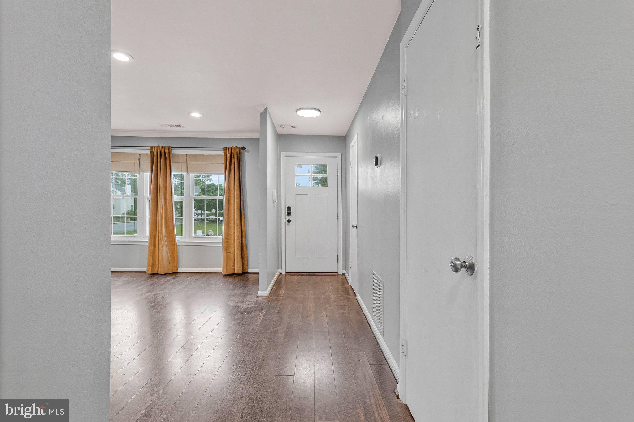 1675 Ridgely Court, Unit 182 Crofton, MD 21114 - Photo 20 of 47 wooden floor in a hall with an entryway