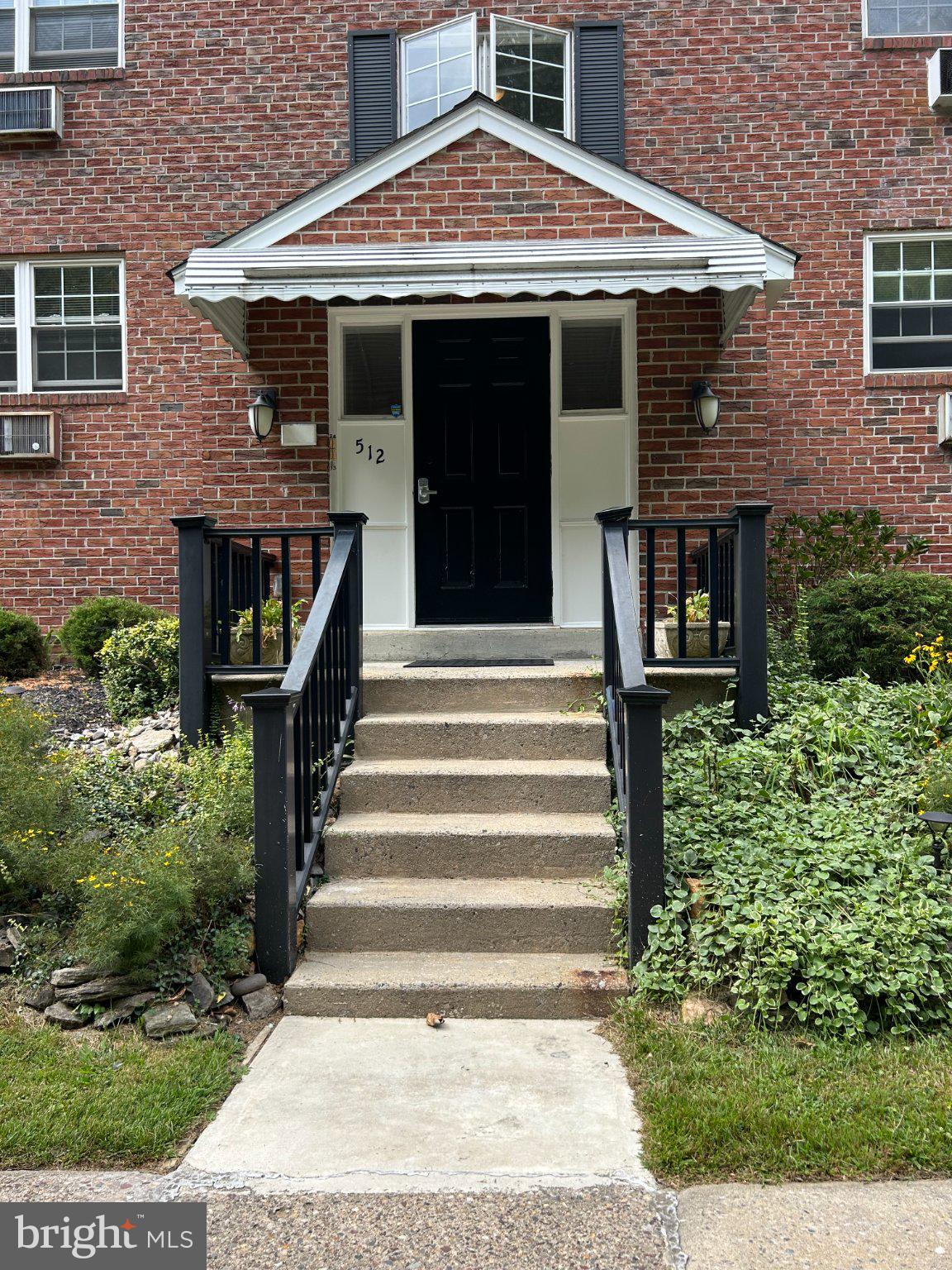 512 Stidman Drive, Unit D4 Springfield, PA 19064 - Photo 2 of 14 Charming entrance to a brick residence.