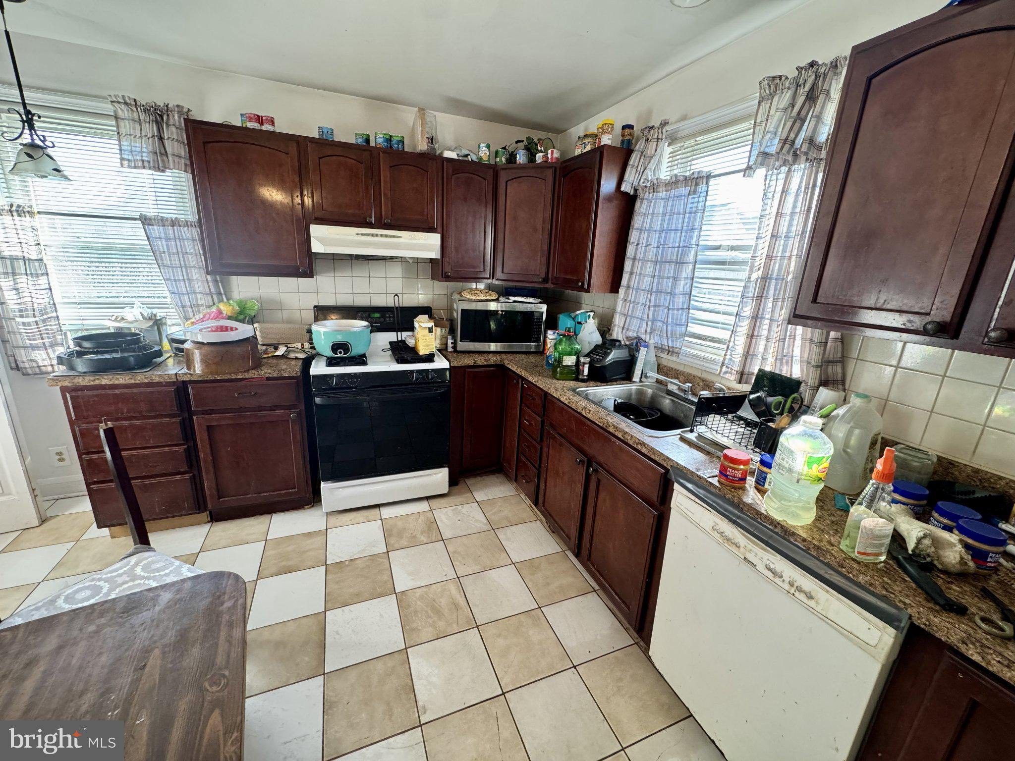 2725 North Point Road Dundalk, MD 21222 - Photo 13 of 34 Charming kitchen with warm wood tones.