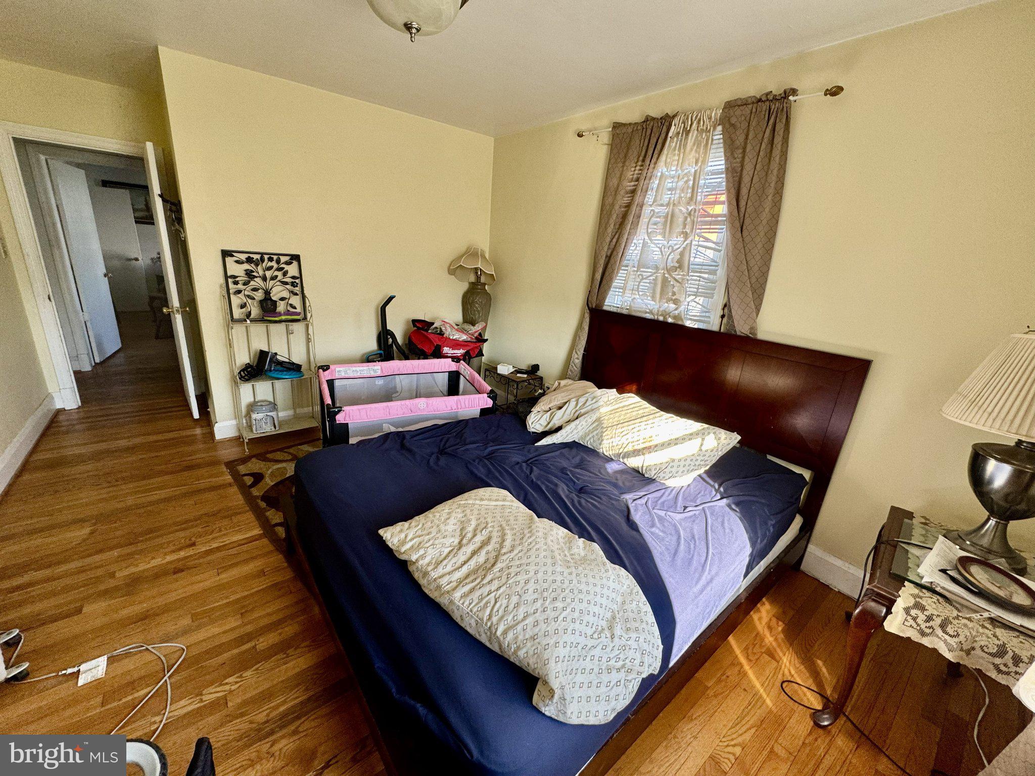2725 North Point Road Dundalk, MD 21222 - Photo 17 of 34 Cozy bedroom with warm wooden floors.