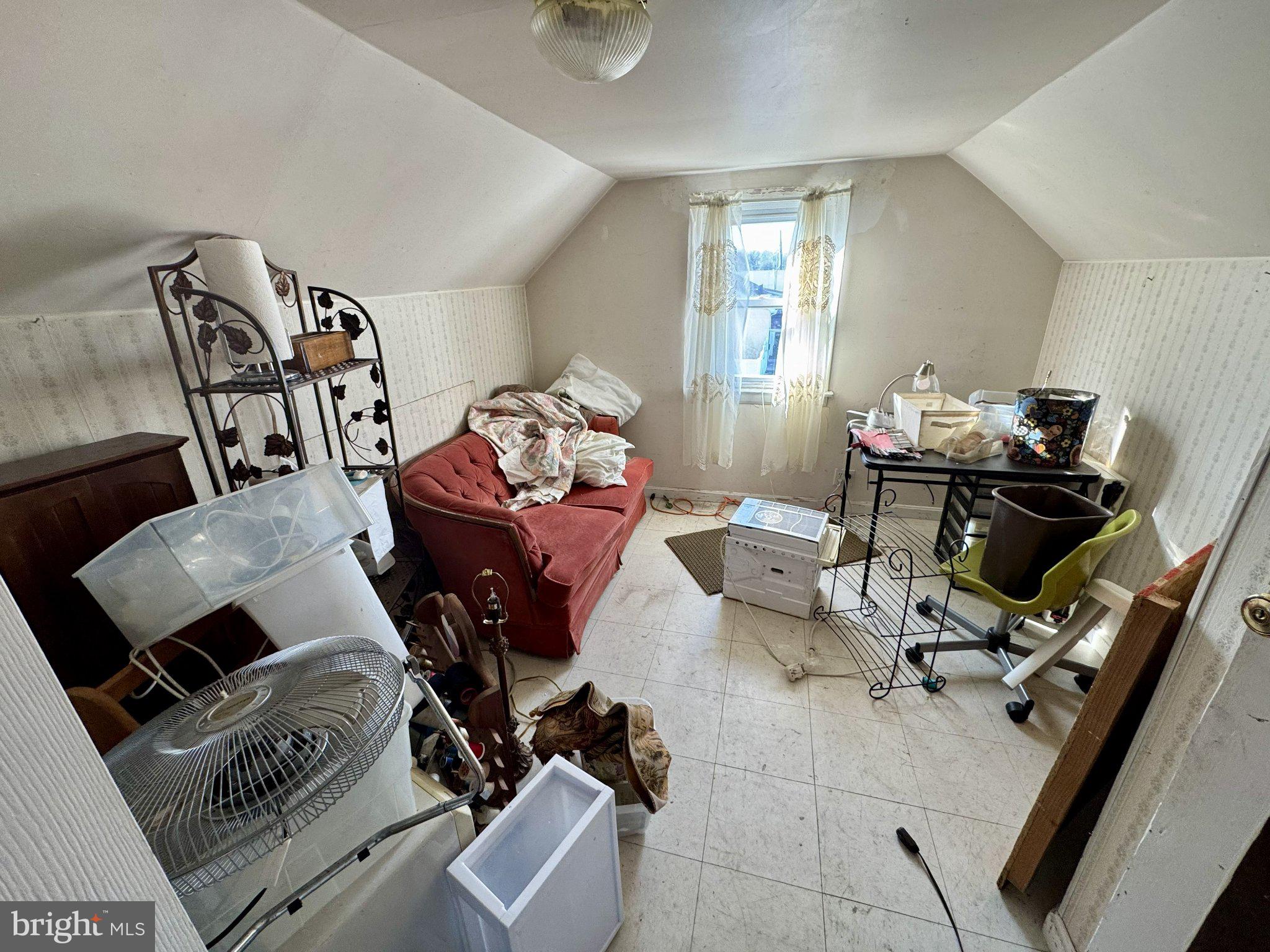 2725 North Point Road Dundalk, MD 21222 - Photo 18 of 34 Cozy attic space with potential charm.