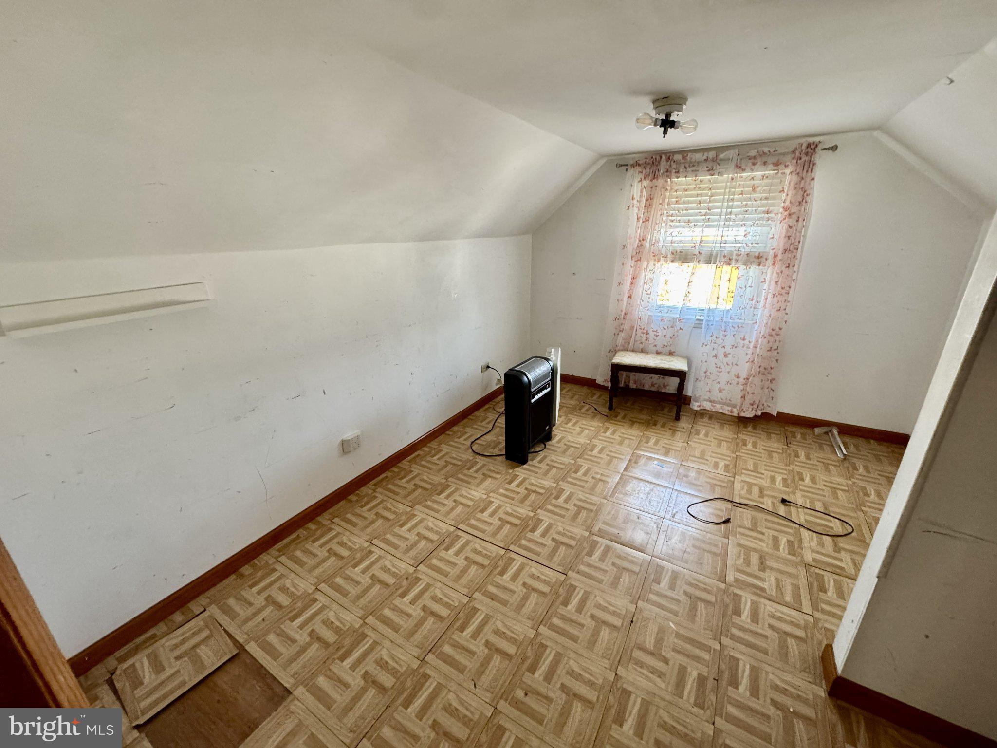 2725 North Point Road Dundalk, MD 21222 - Photo 19 of 34 Cozy attic space with natural light.