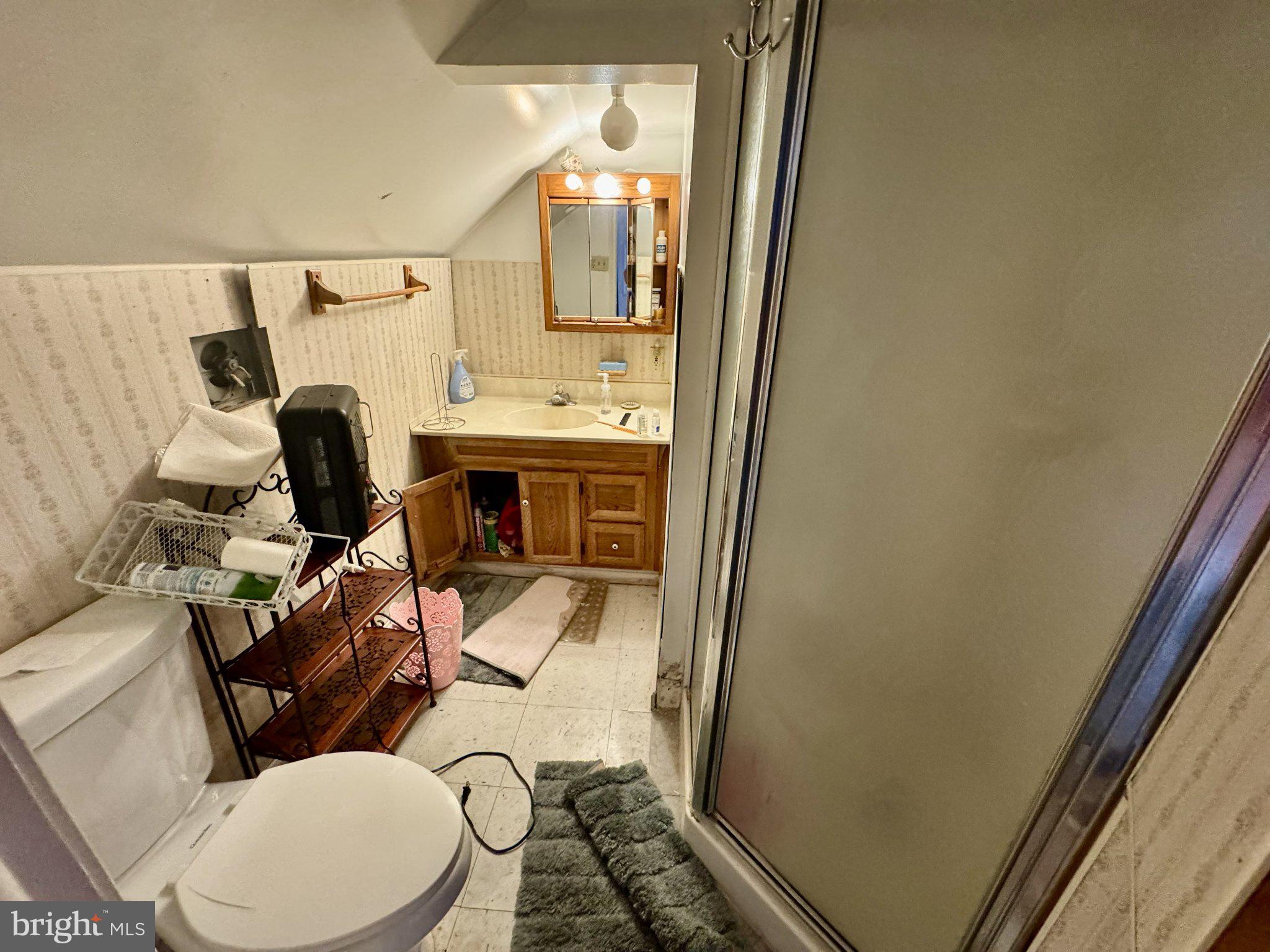 2725 North Point Road Dundalk, MD 21222 - Photo 23 of 34 Cozy attic bathroom with vintage charm.