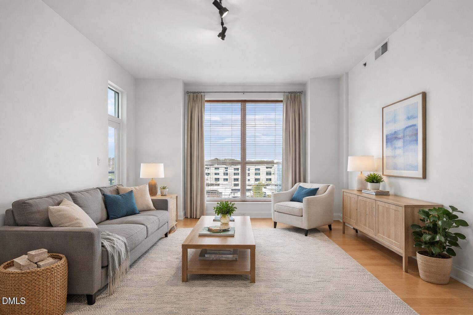 a living room with furniture and windows