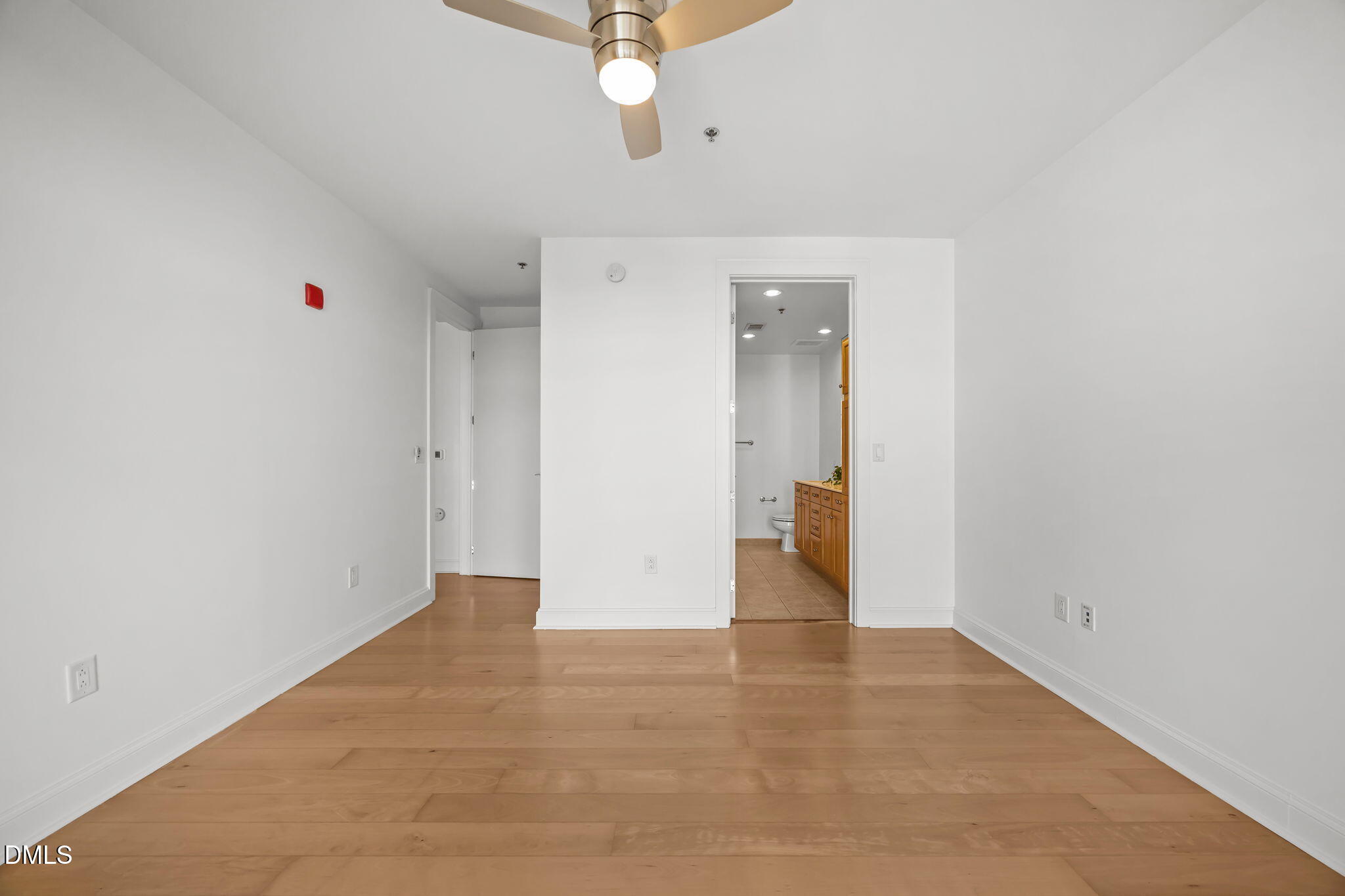 618 North Boylan Avenue, Unit 702 Raleigh, NC 27603 - Photo 17 of 42 a view of an empty room with a ceiling fan
