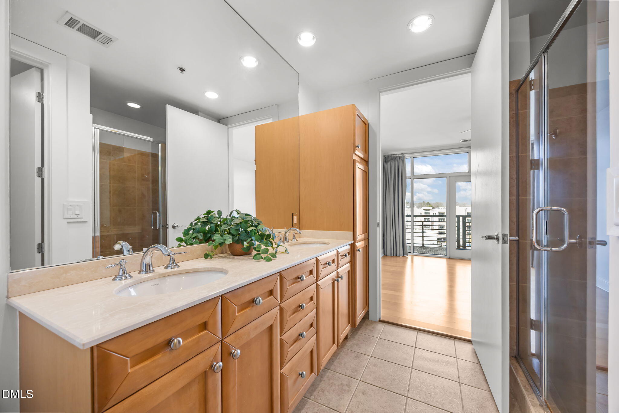 618 North Boylan Avenue, Unit 702 Raleigh, NC 27603 - Photo 22 of 42 a bathroom with a double vanity sink and mirror