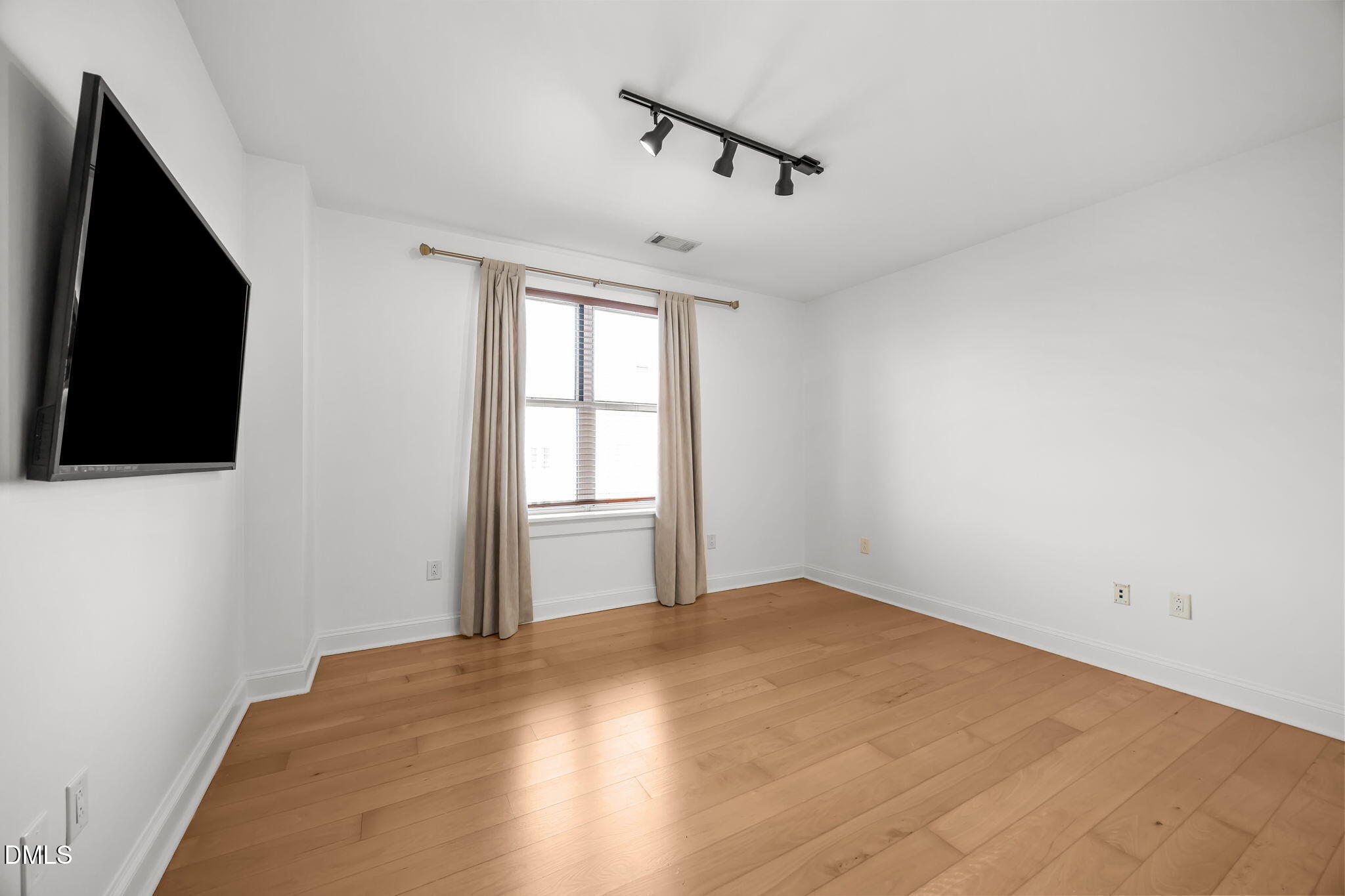 618 North Boylan Avenue, Unit 702 Raleigh, NC 27603 - Photo 26 of 42 an empty room with windows and fireplace