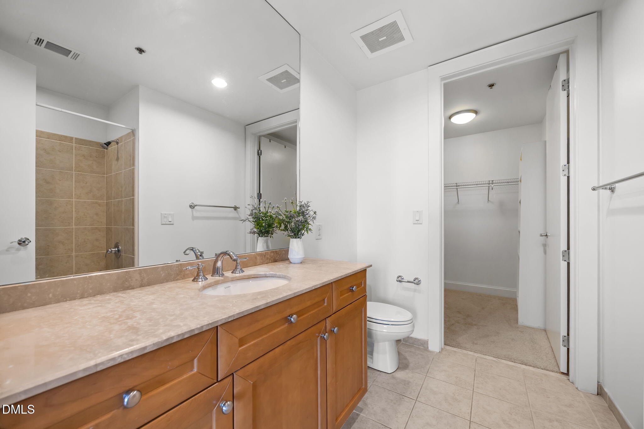 618 North Boylan Avenue, Unit 702 Raleigh, NC 27603 - Photo 30 of 42 a bathroom with a double vanity sink toilet and shower