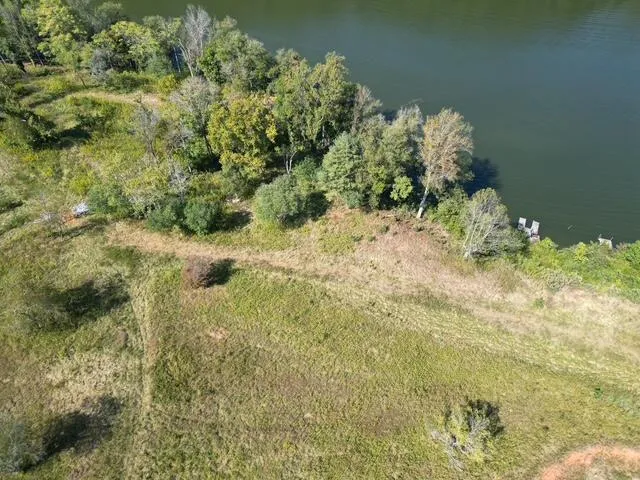 a view of a lake with a yard