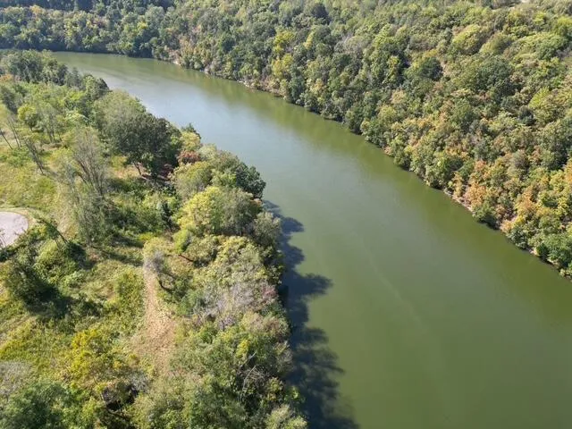 a view of a field with an ocean view