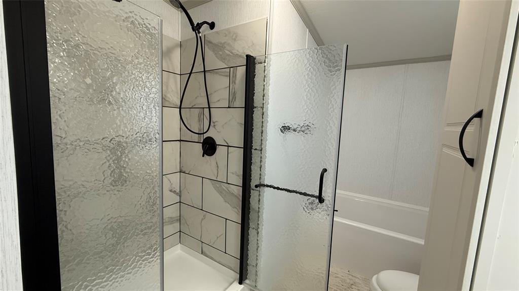 244 Overland Trail Runaway Bay, TX 76426 - Photo 11 of 15 a bathroom with a shower