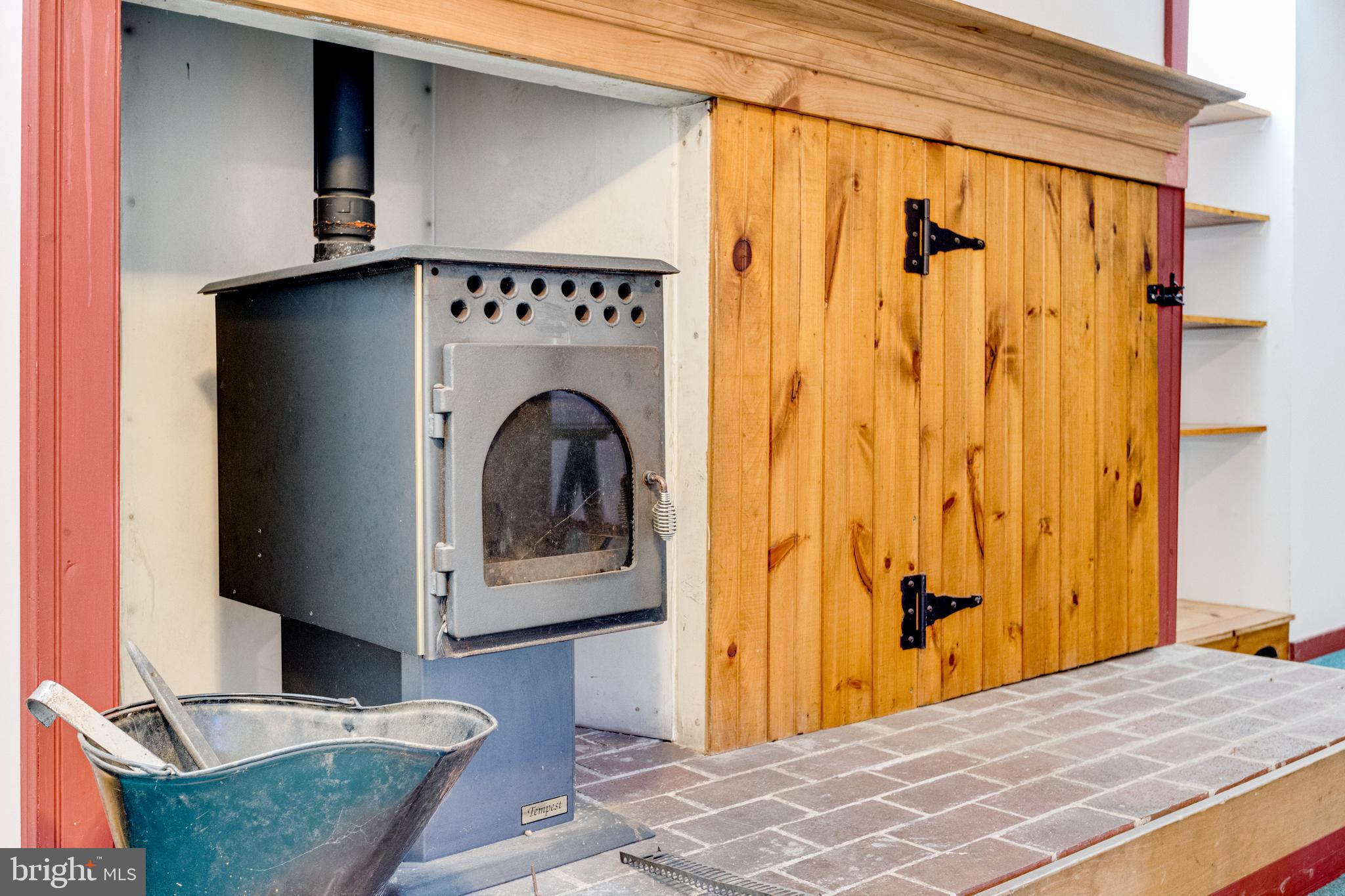 504 Hances Point Road North East, MD 21901 - Photo 17 of 24 Pellet stove and storage cabinet