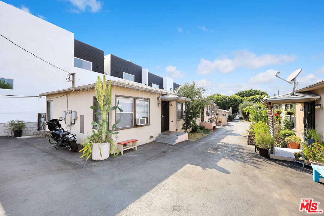 3214 Verdugo Road Los Angeles, CA 90065 - Photo 15 of 23 a view of a building with potted plants and a barbeque