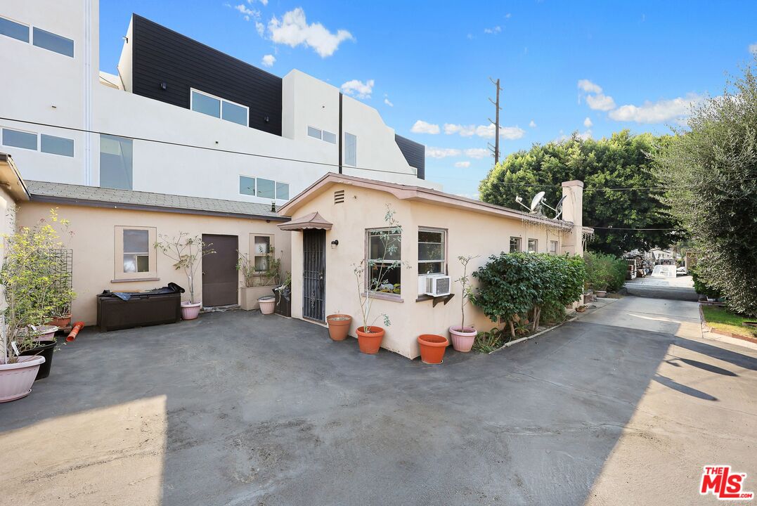 3214 Verdugo Road Los Angeles, CA 90065 - Photo 6 of 23 a white house with a table and chairs in patio