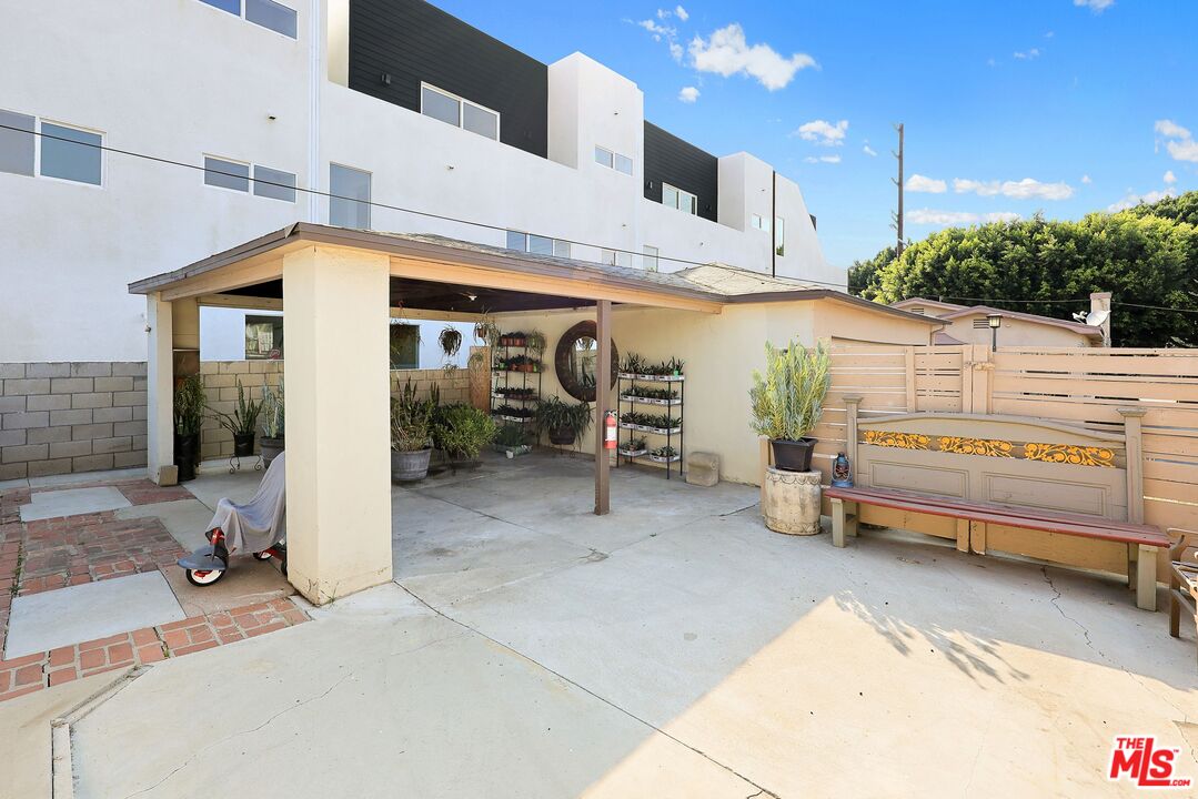 3214 Verdugo Road Los Angeles, CA 90065 - Photo 8 of 23 a view of a patio with table and chairs with wooden fence