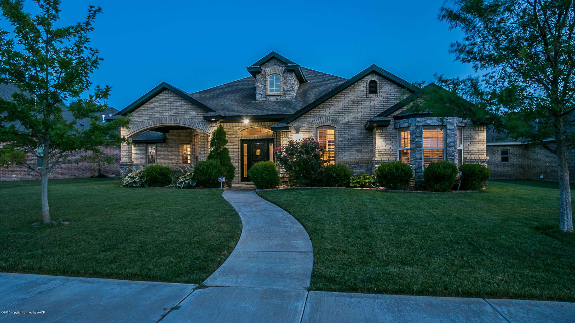 7411 Countryside Drive Amarillo, TX 79119 - Photo 1 of 39 a front view of a house with a yard