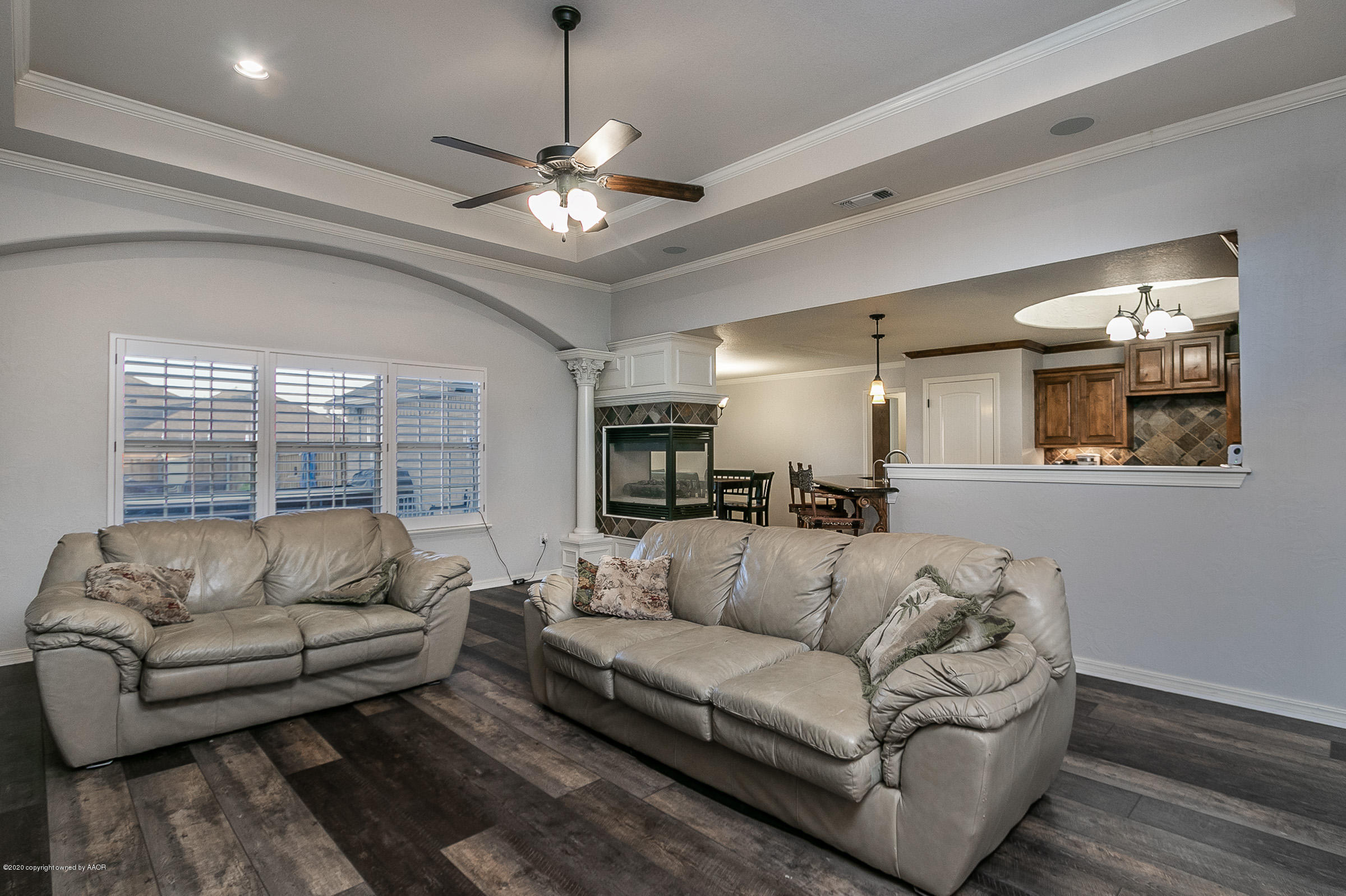 7411 Countryside Drive Amarillo, TX 79119 - Photo 11 of 39 a living room with furniture and a large window