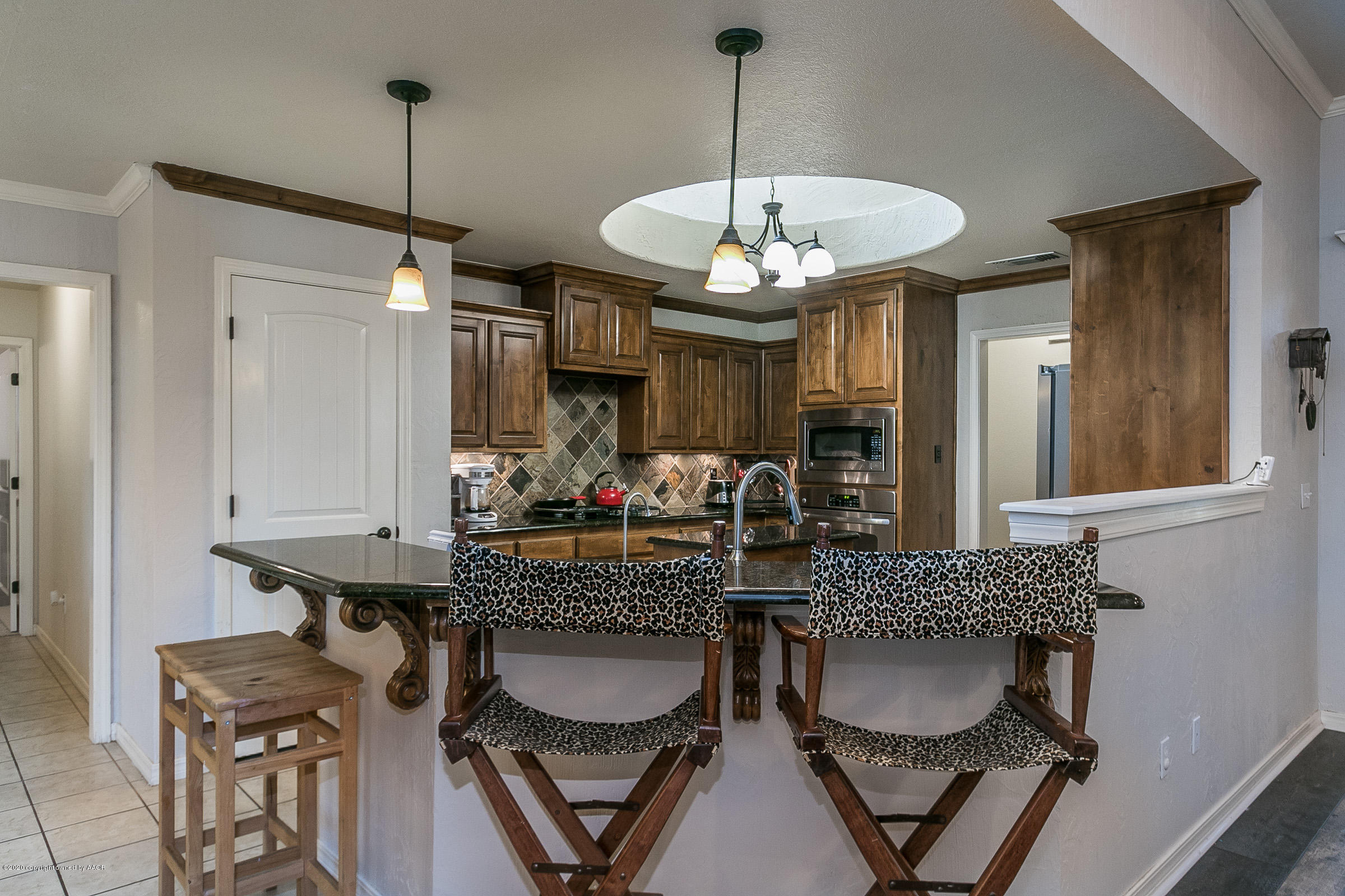7411 Countryside Drive Amarillo, TX 79119 - Photo 15 of 39 a view of a dining room with furniture