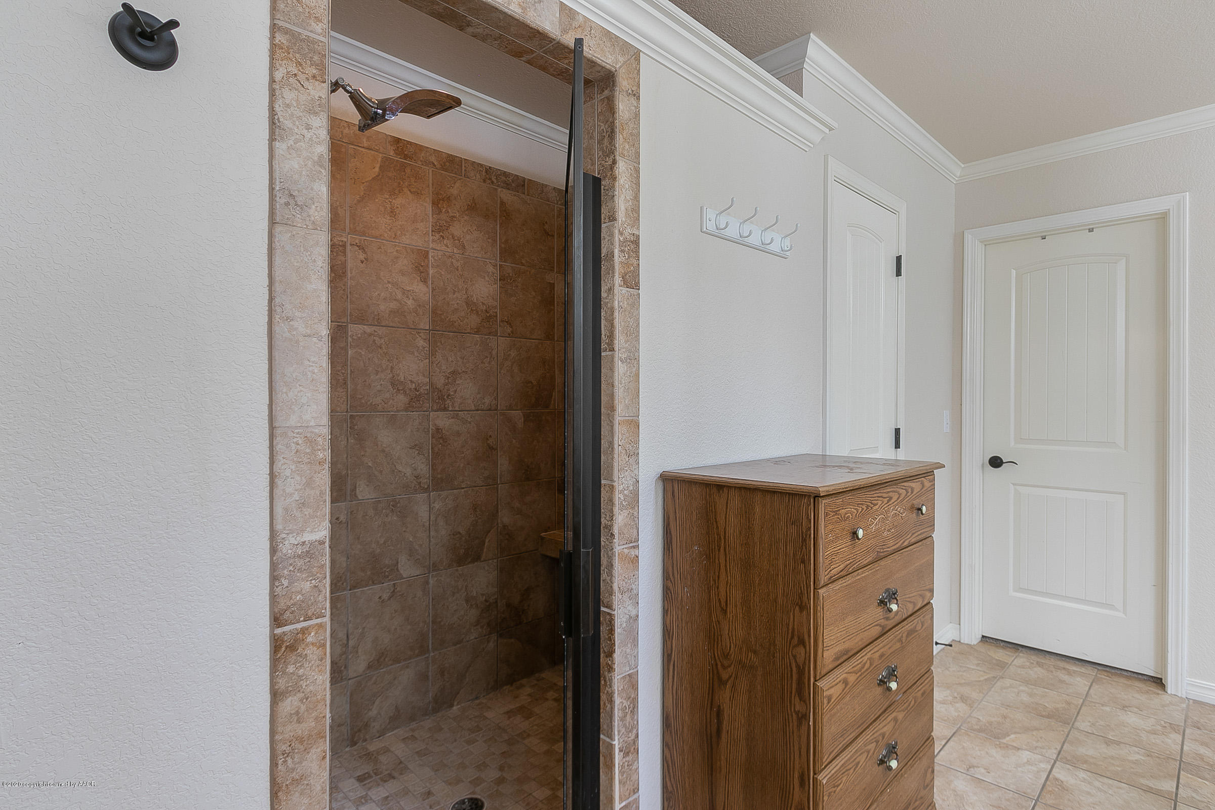 7411 Countryside Drive Amarillo, TX 79119 - Photo 20 of 39 a bathroom with a shower and a sink